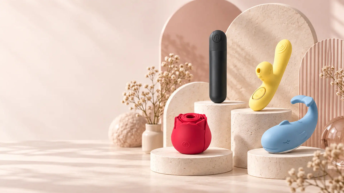 PleasureDept product assortment arranged on warm studio pedestals